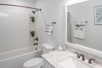 Renovated bathrooms with quartz counters